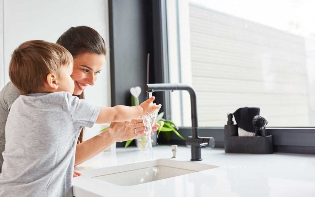 4. zero waste hand soap for your family mom washing her baby's hand by hand soap