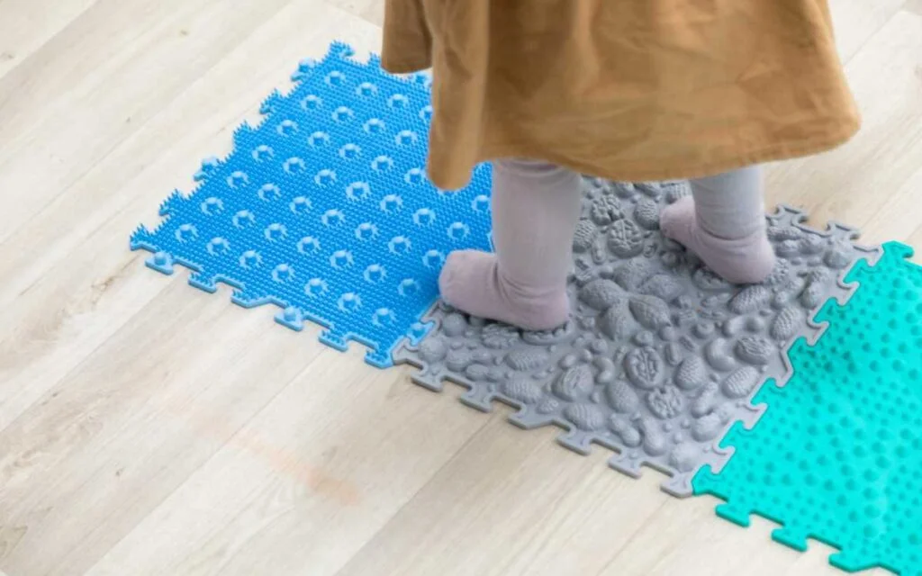 13.How to Choose the Right Organic Non-Toxic Play Mat for Your Child Kid standing on Organic Non-Toxic Play Mat